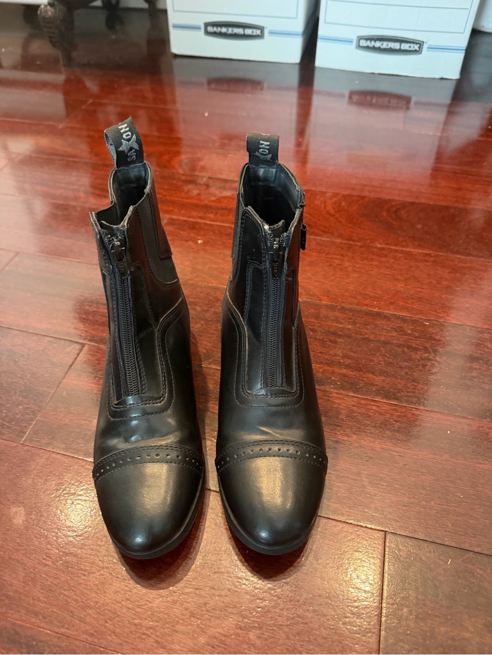Black leather riding boots with zipper